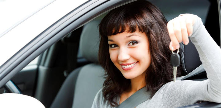 Girl in car holding keys