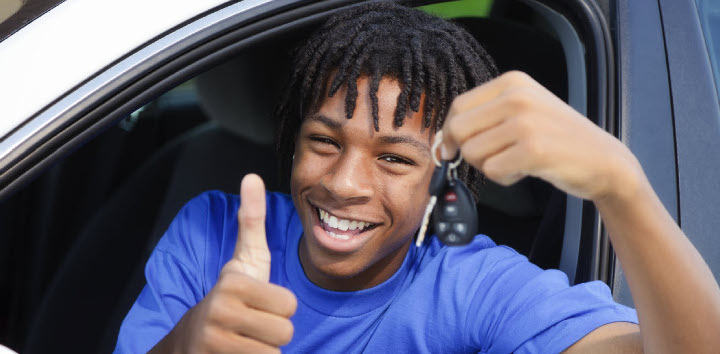 Boy in car holding keys